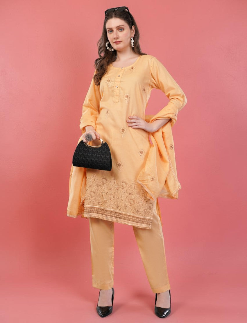 Eelika peach cotton salwar suit set featuring embroidered knee-length kurta, trousers, and matching dupatta.