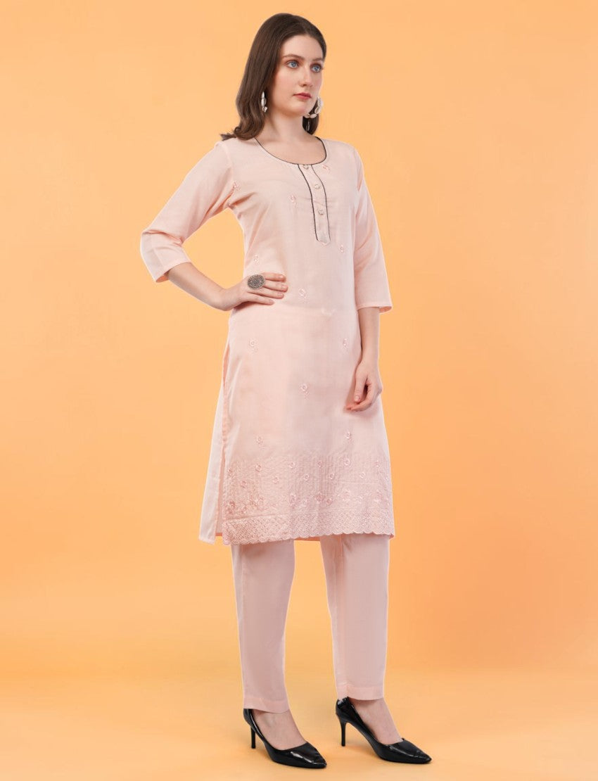 Eelika peach cotton salwar suit set featuring a knee-length embroidered kurta with 3/4th sleeves and matching trousers