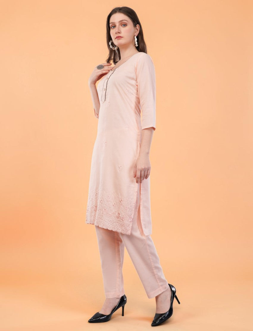 Eelika peach cotton salwar suit set featuring a knee-length embroidered kurta with 3/4 sleeves and matching trousers