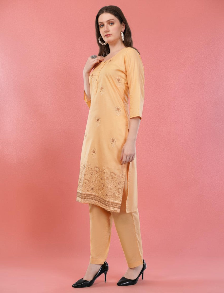Eelika peach cotton salwar suit set featuring knee-length embroidered kurta with 3/4 sleeves and matching trousers