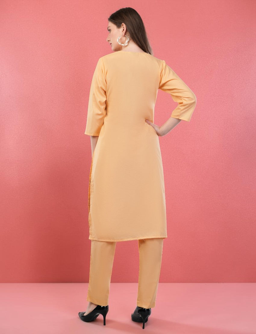Back view of a woman wearing an Eelika peach cotton salwar suit set with 3/4th sleeves and matching trousers