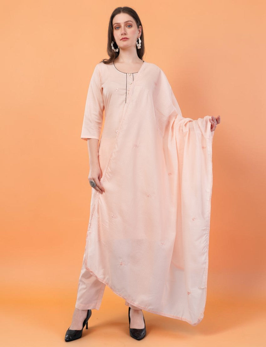 Model wearing an Eelika peach cotton salwar suit set with 3/4th sleeves, knee-length kurta, trousers, and dupatta.