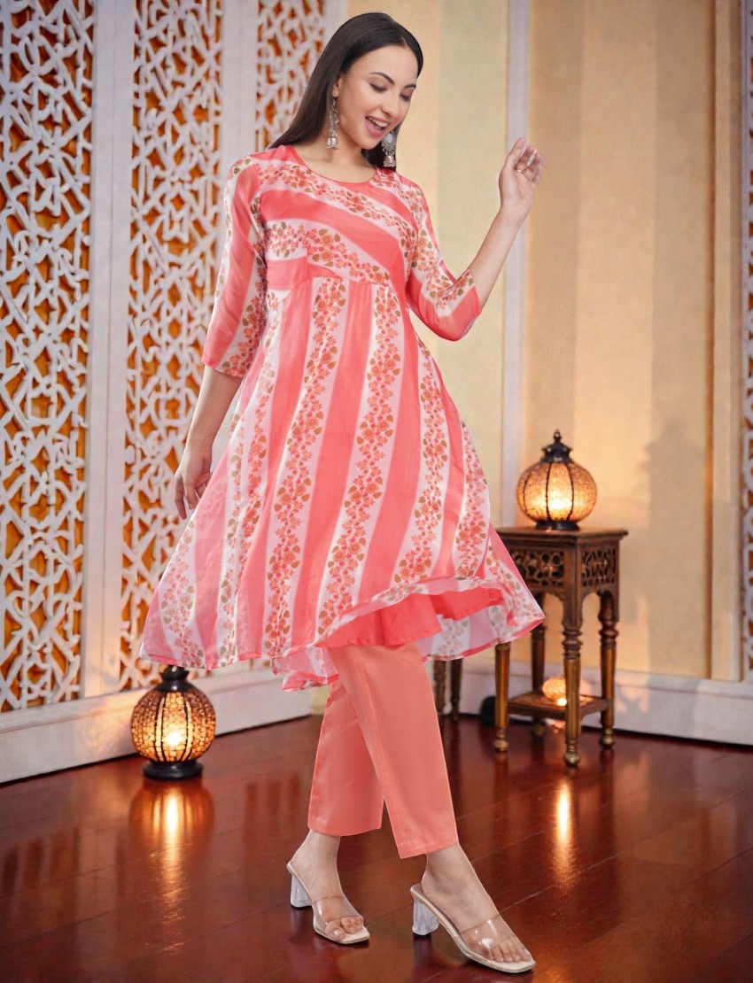 Eelika peach organza Anarkali kurta with floral print, 3/4 sleeves, and matching cotton trousers in a studio setting.