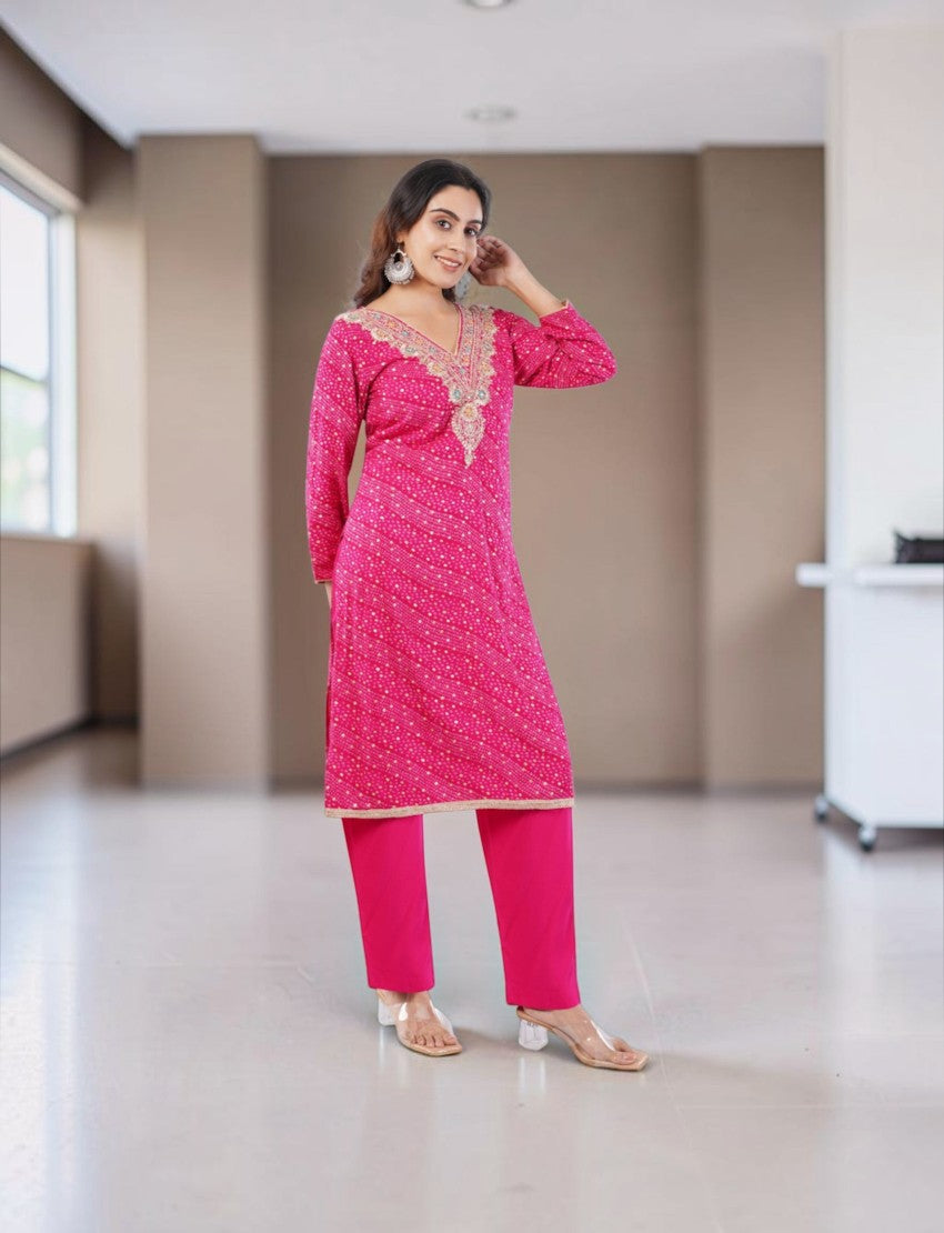 Model wearing a pink Eelika cotton Bandhani kurta set with V-neck, 3/4th sleeves, and matching dupatta
