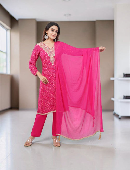 Eelika pink cotton Bandhani kurta set with V-neck, 3/4th sleeves, and matching dupatta worn by a model
