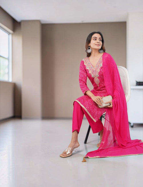 Model wearing a pink Eelika Bandhani cotton kurta set with V-neck, 3/4th sleeves, and matching dupatta