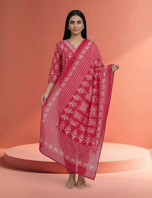 Eelika 3-piece cotton salwar suit set in pink with white floral print, V-neck, 3/4 sleeves, and matching dupatta.