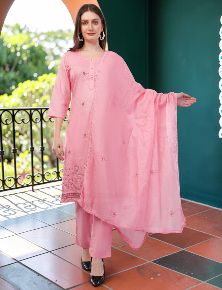 Model wearing an Eelika pink cotton salwar suit set with embroidered kurta, matching trousers, and a light dupatta.