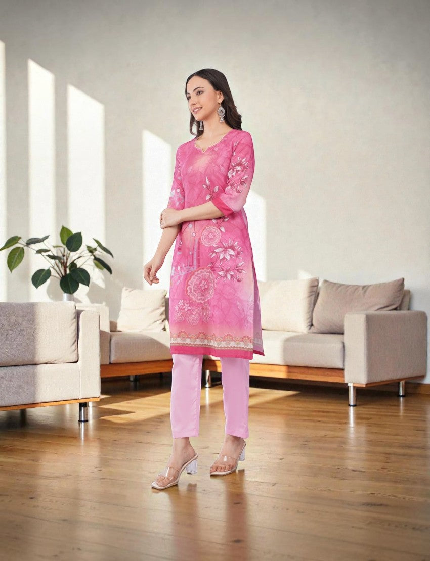 Eelika pink cotton salwar suit set featuring a calf-length floral print kurta with V-neck and 3/4th sleeves