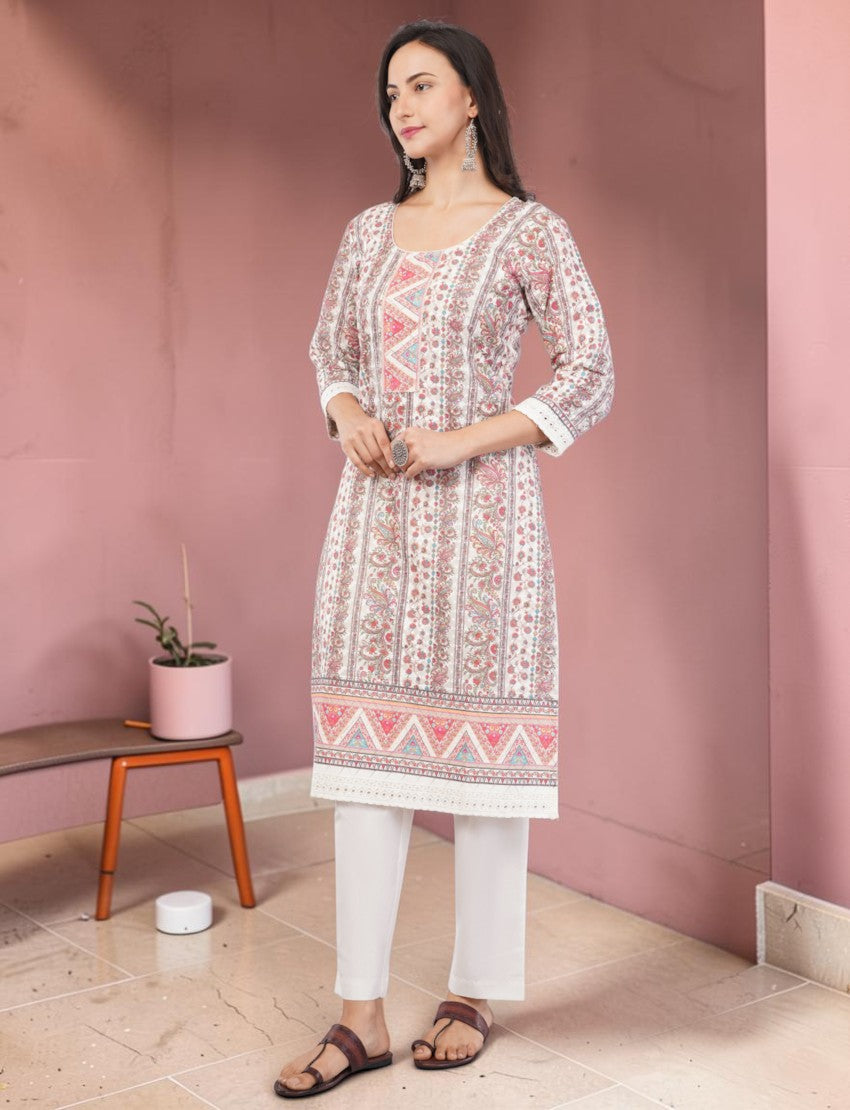 Eelika cotton salwar suit set featuring a knee-length printed kurta with 3/4 sleeves and matching white trousers.