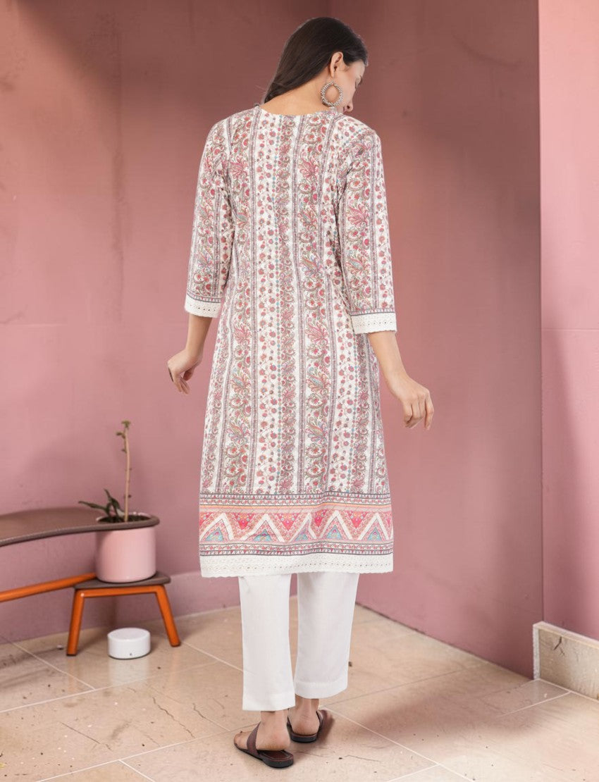 Eelika cotton salwar suit set with pink floral print, knee-length kurta, 3/4 sleeves, and white trousers, back view