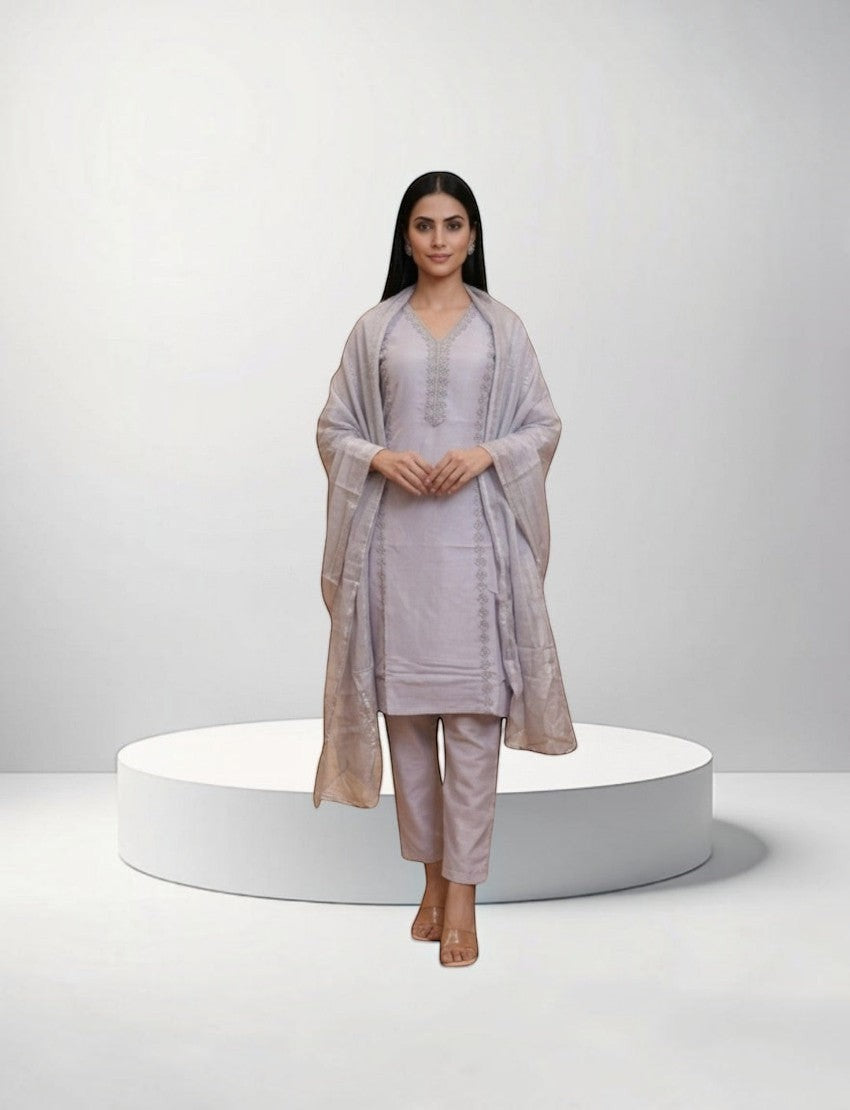 Model wearing an Eelika light purple cotton salwar suit set with V-neck, 3/4 sleeves, trousers, and matching dupatta.