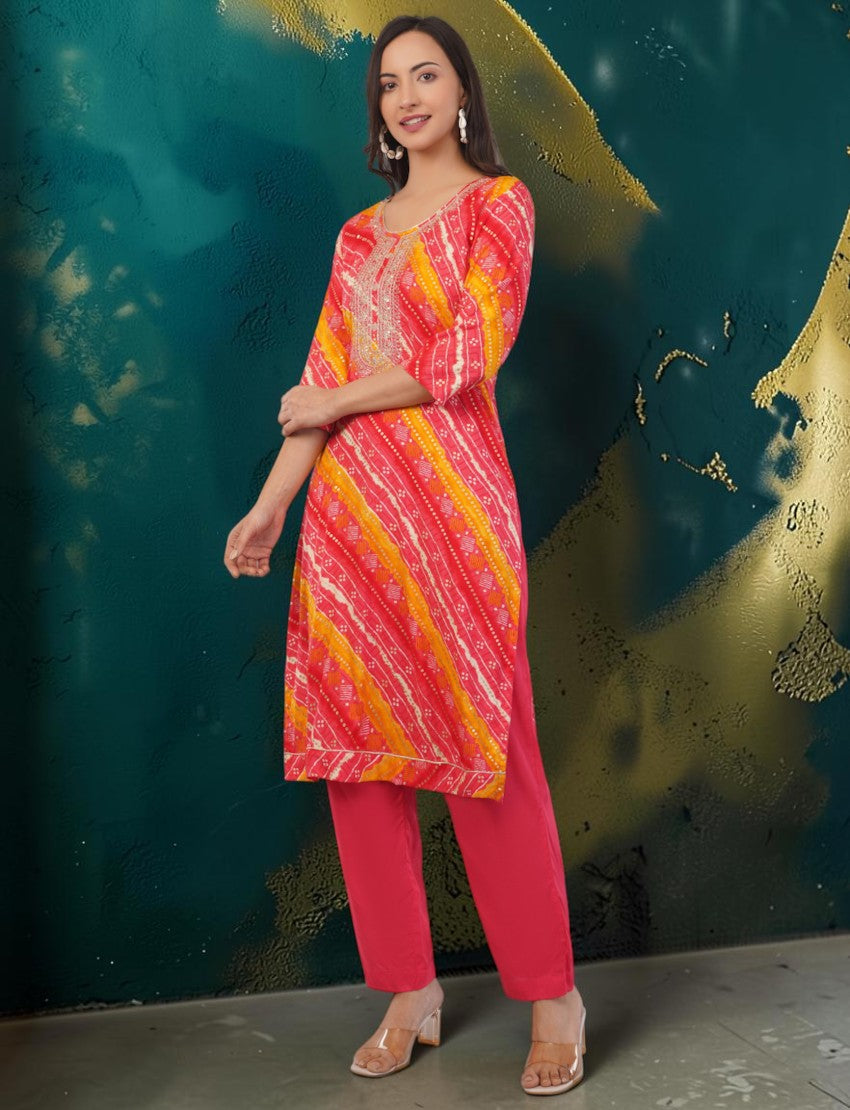 Eelika red and yellow cotton Bandhani print kurta set with 3/4 sleeves, matching trousers, and dupatta on a model.