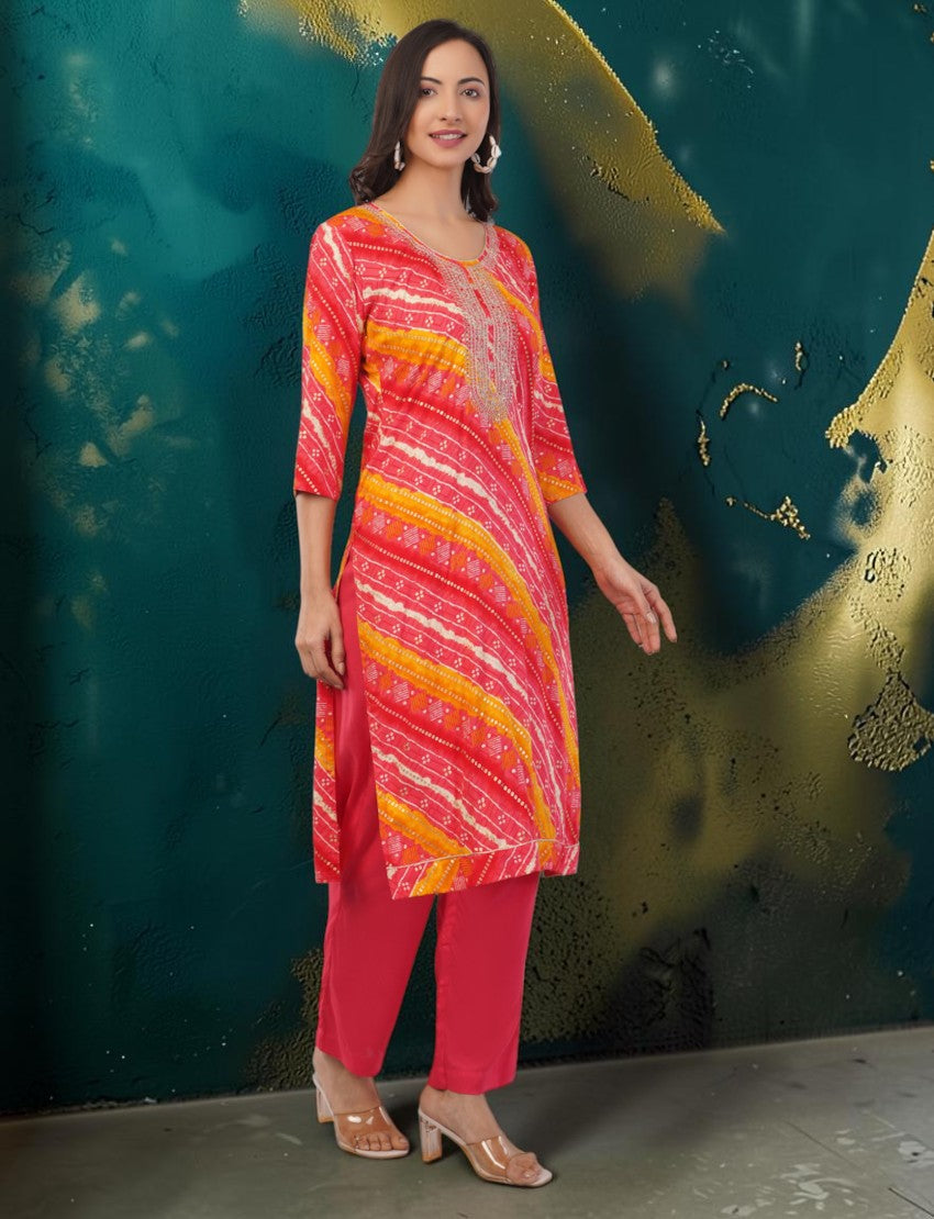 Eelika women's red and yellow cotton Bandhani print kurta set with 3/4 sleeves, matching trousers, and round neck.