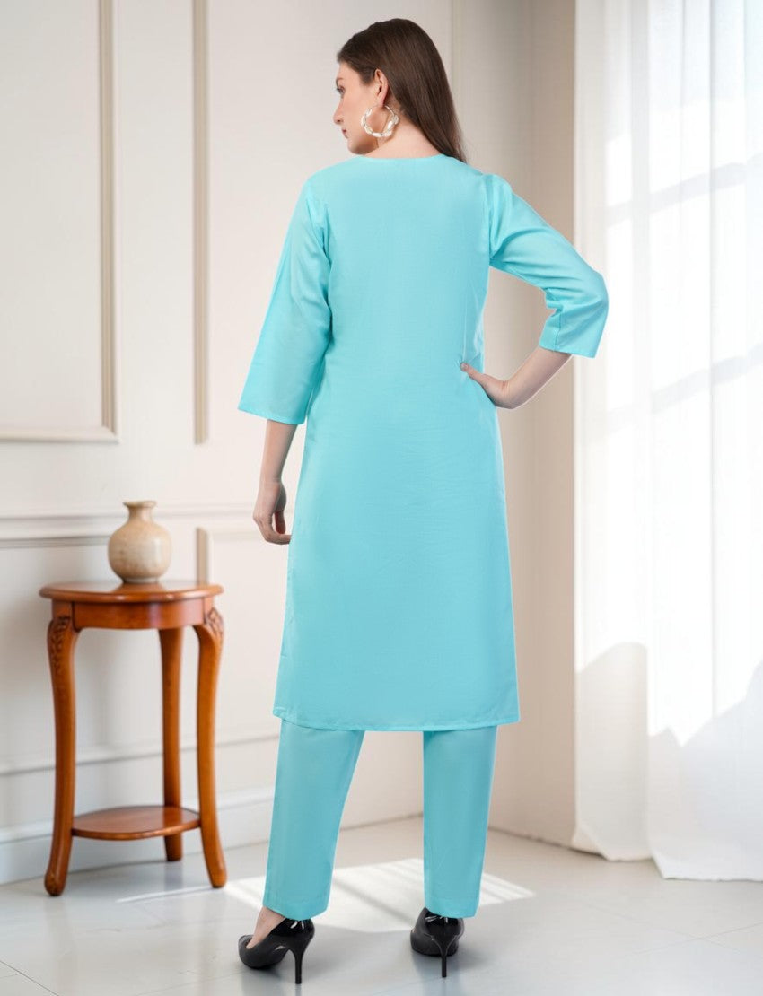 Eelika turquoise cotton salwar suit set featuring a knee-length kurta with 3/4 sleeves and matching trousers