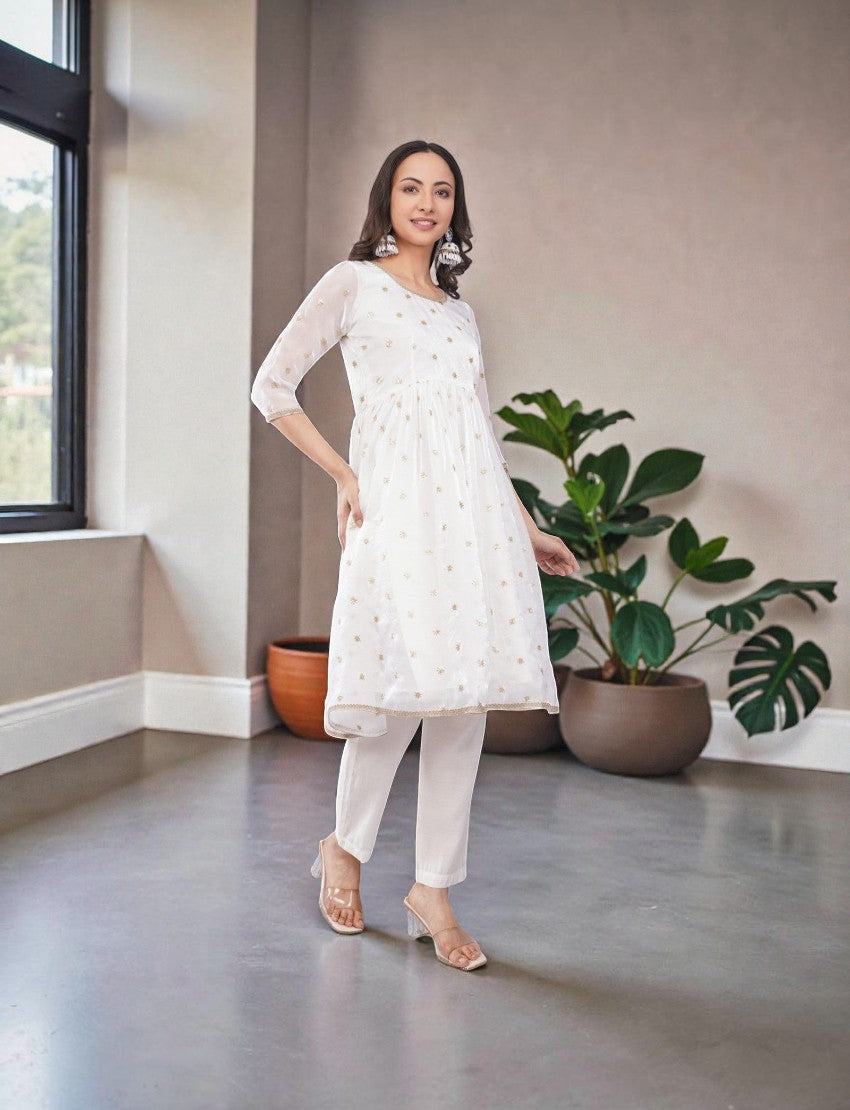 Eelika white chiffon salwar suit set featuring a calf-length kurta with gold embroidery, 3/4 sleeves, and trousers.
