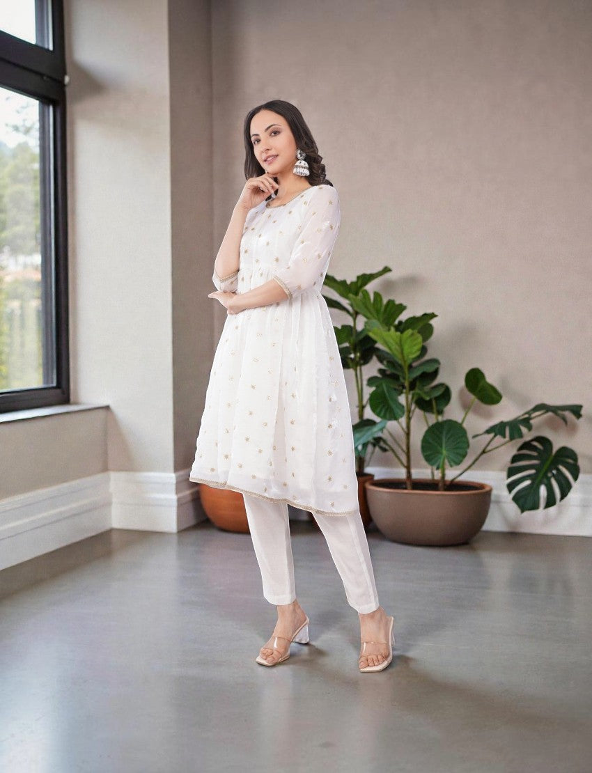 Eelika white chiffon salwar suit set with gold embroidery, round neck, 3/4 sleeves, and matching cotton trousers