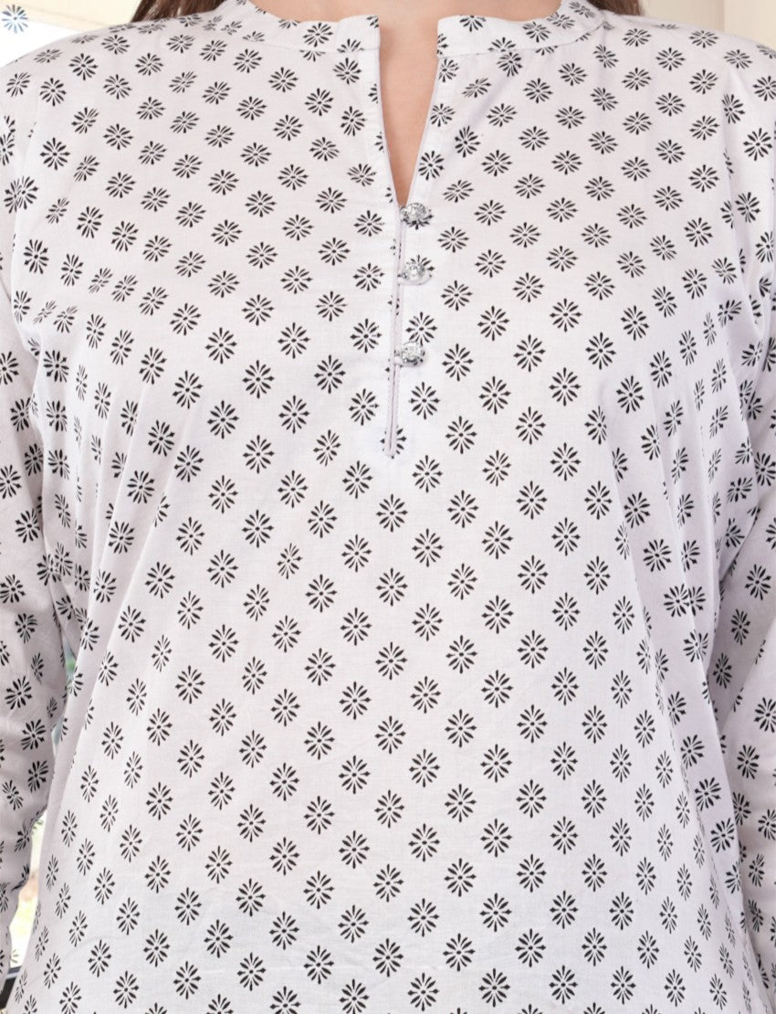 Eelika white cotton kurti featuring a black geometric print, mandarin collar, and button-down front detail.