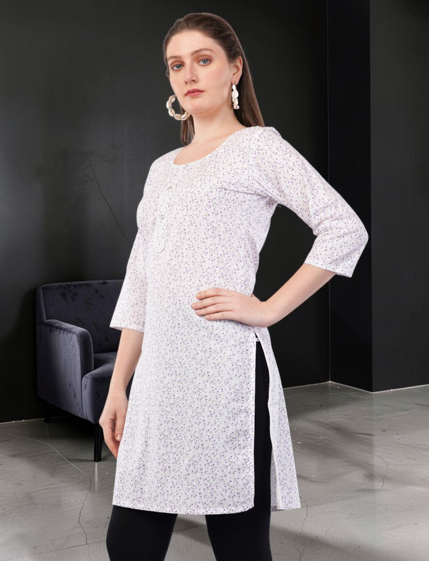 Eelika women's white cotton kurti featuring a purple floral print, round neck, and 3/4 sleeves, worn by a model.