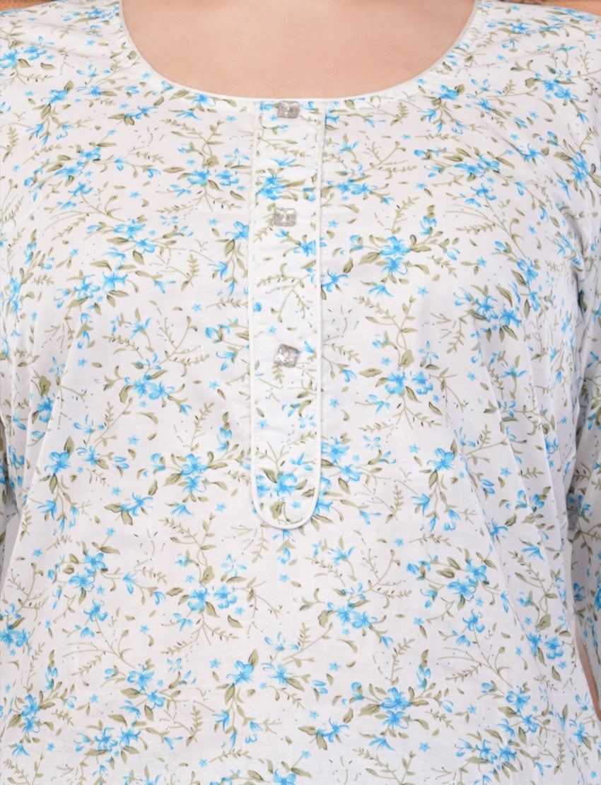 Eelika women's white cotton kurti featuring a blue floral print, round neck, and button-down placket detail.