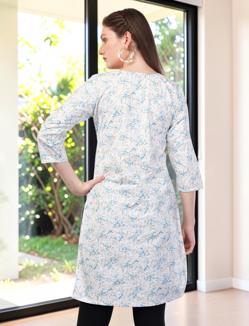 Eelika white cotton kurti with blue floral geometric print, 3/4 sleeves, and mandarin collar, back view on model.
