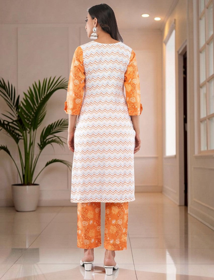Eelika women's white and orange cotton salwar suit set with geometric print, 3/4 sleeves, and matching trousers