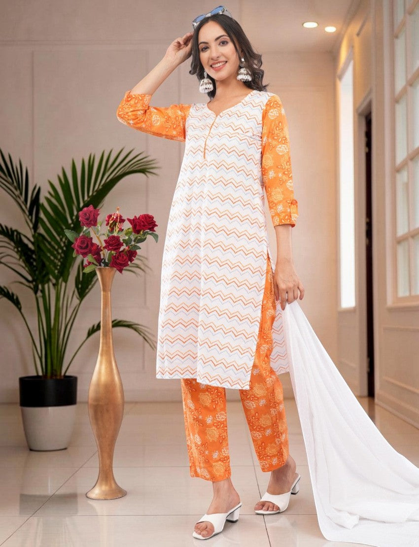 Eelika women's white and orange cotton salwar suit set with geometric print, V-neck, 3/4 sleeves, and matching dupatta