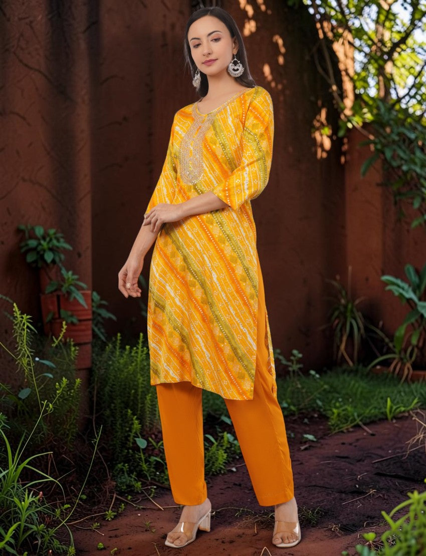 Eelika yellow and orange cotton Bandhani print salwar suit set with embroidered round neck and 3/4 sleeves