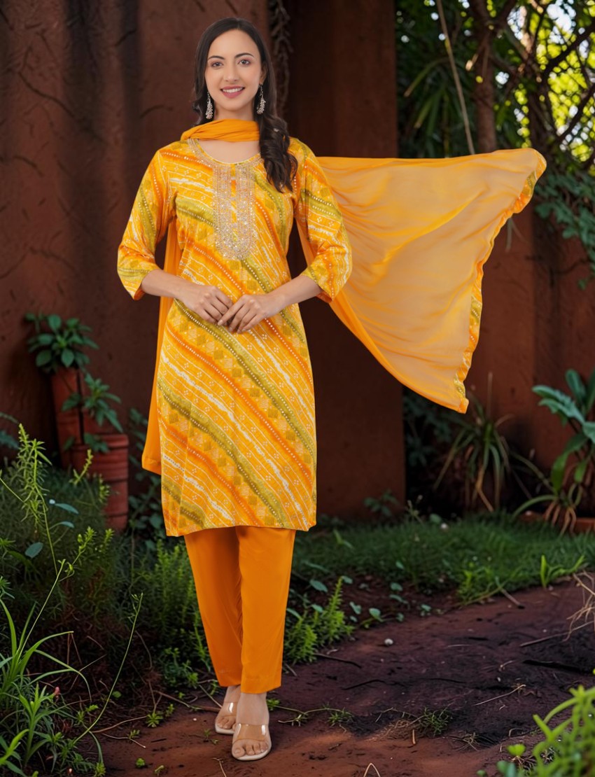 Eelika yellow and orange cotton Bandhani print salwar suit with embroidered neckline, 3/4 sleeves, and a dupatta.