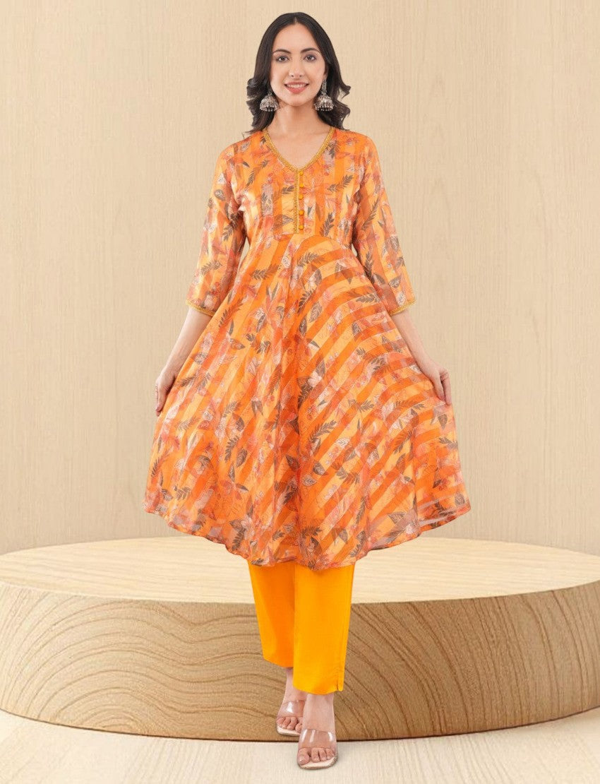 Eelika women's yellow chiffon calf-length kurta with geometric print, V-neck, 3/4 sleeves, and matching cotton trousers.