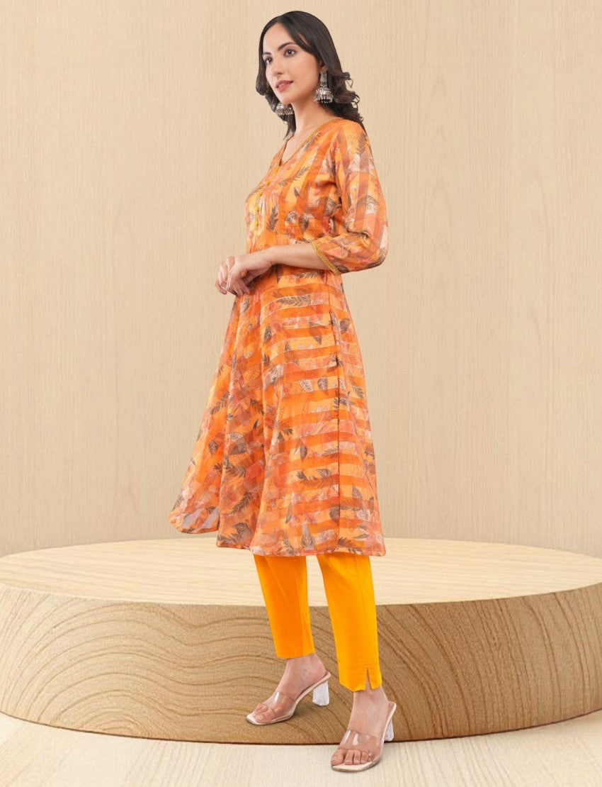 Eelika women's yellow chiffon calf-length salwar suit with geometric print, V-neck, 3/4 sleeves, and cotton trousers.