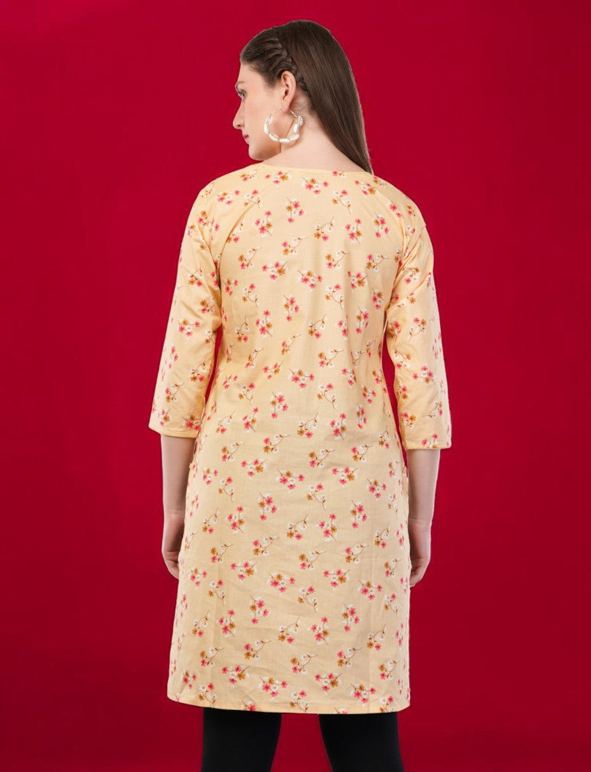 Back view of a woman wearing an Eelika yellow cotton kurti with a floral print, round neck, and 3/4 sleeves.