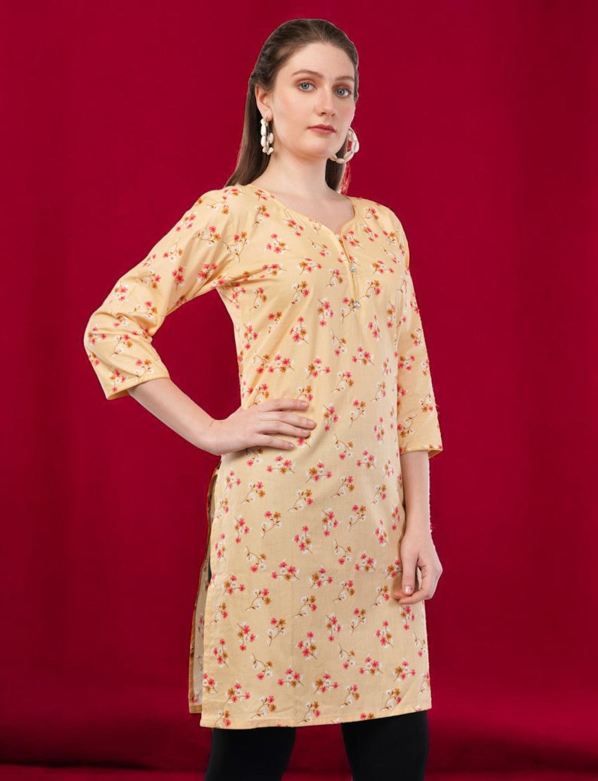Eelika women's yellow cotton kurti with floral print, round neck, and 3/4 sleeves, worn by a model.
