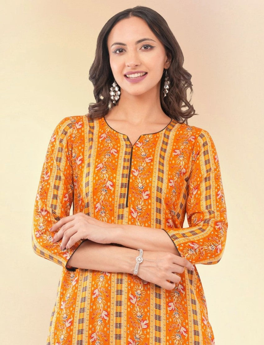 Model wearing an Eelika yellow cotton V-neck kurta with floral prints and three-quarter sleeves